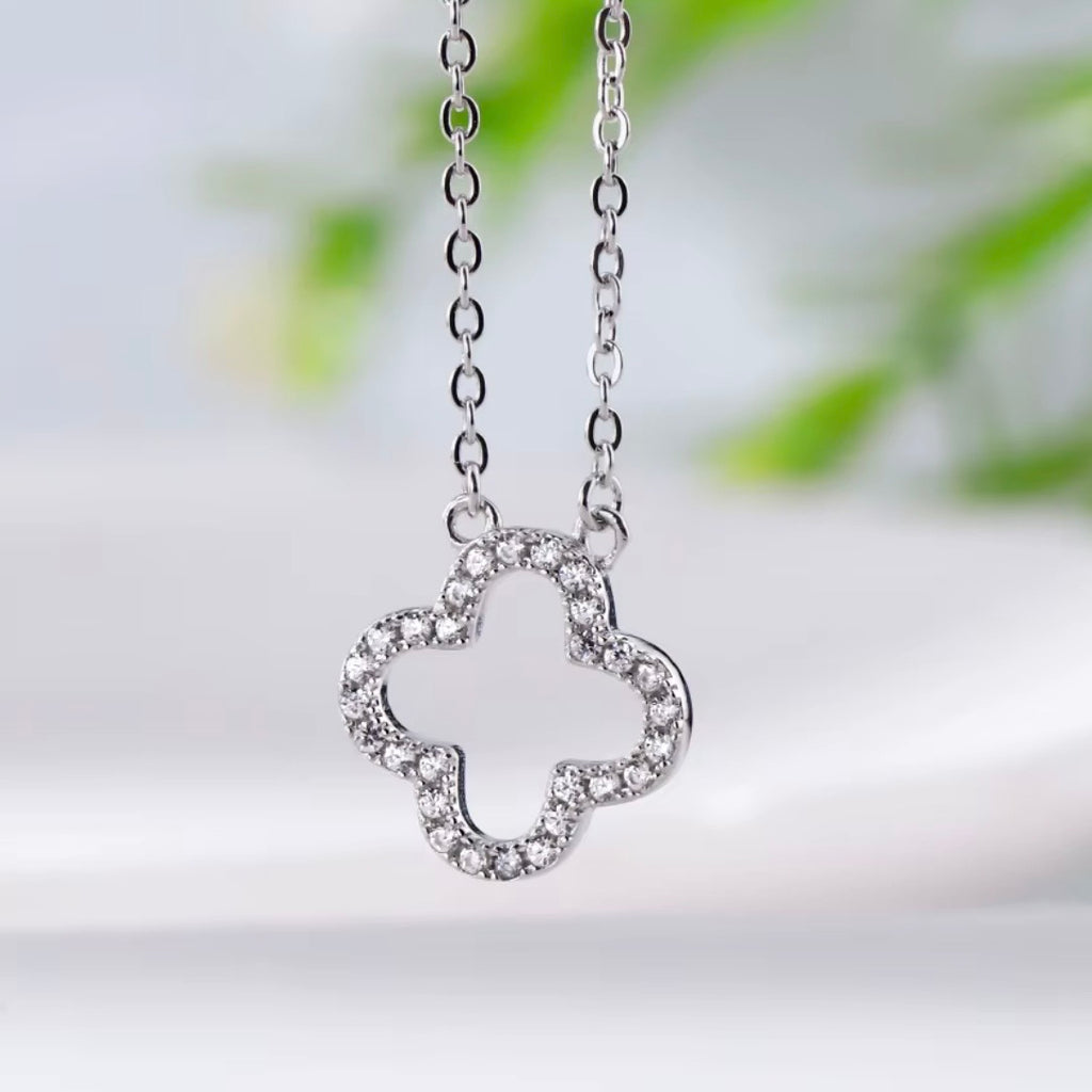 Hollowed out four leaf clover necklace