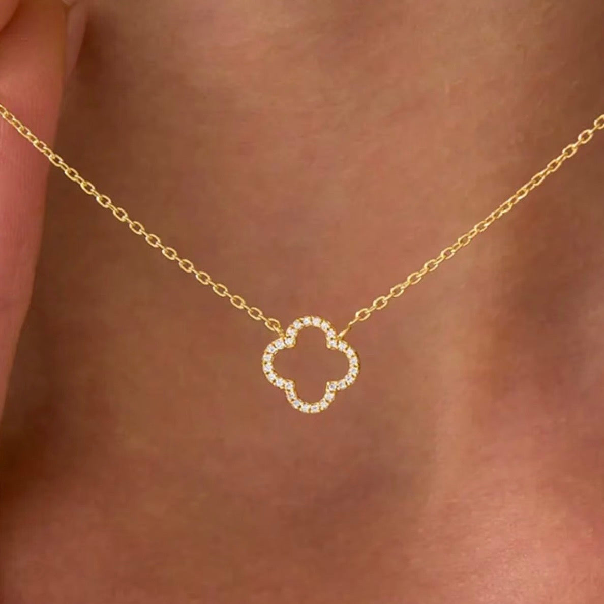 Hollowed out four leaf clover necklace